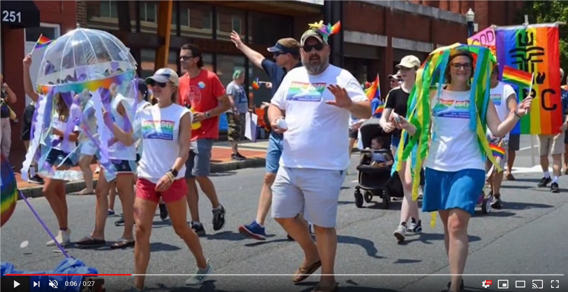 CBF staff in t-shirts bearing the CBF logo and Pride rainbow walk in the parade.